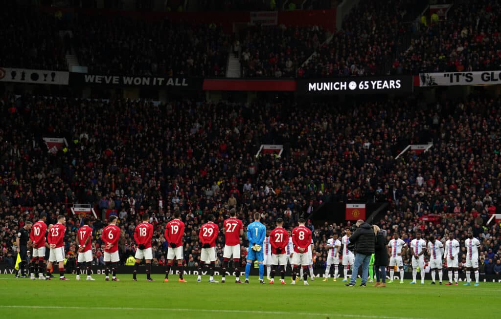 Manchester United and Crystal Palace players observe a moments silence in memory 