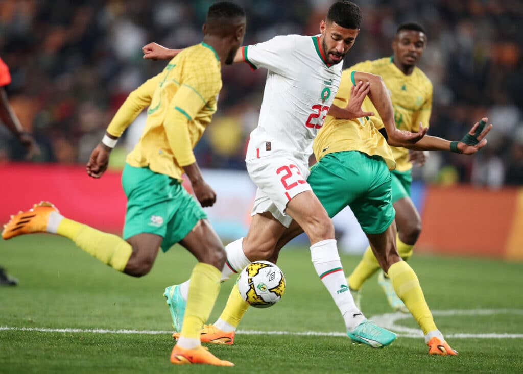 Tarik Tissoudali of Morocco challenged by Mothobi Mvala of South Africa during the 2023 Africa Cup of Nations Qualifiers 