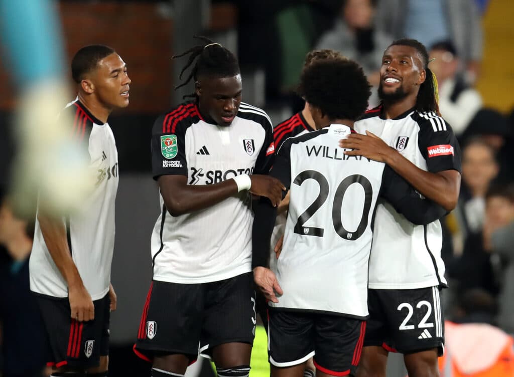 Alex Iwobi embracing his Fulham teammates
