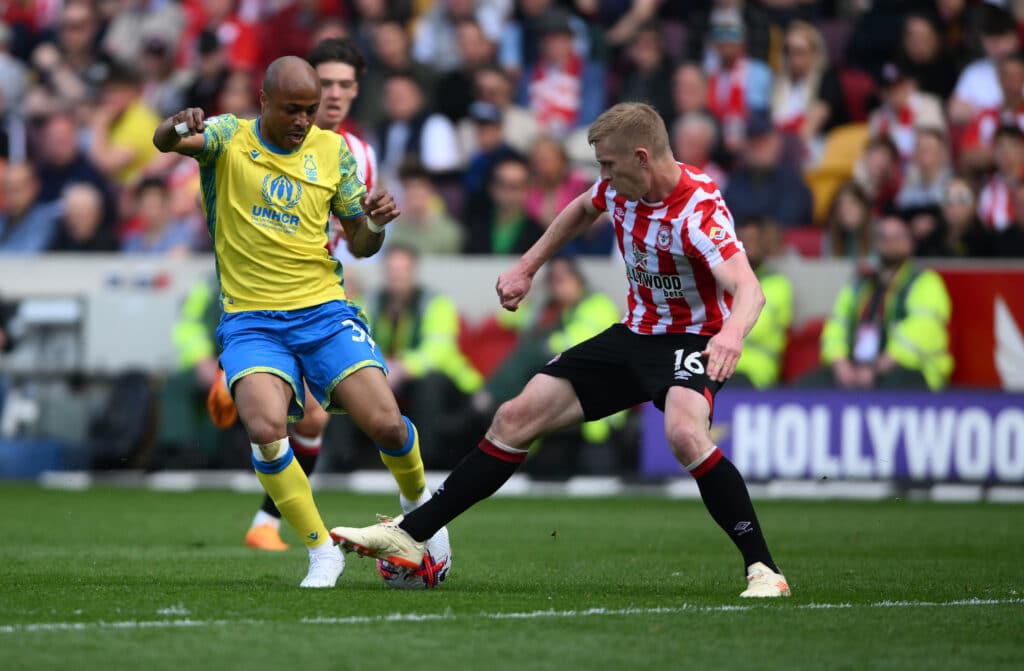 Brentford's Ben Mee tackles Nottingham Forest's AndrŽ Ayew
