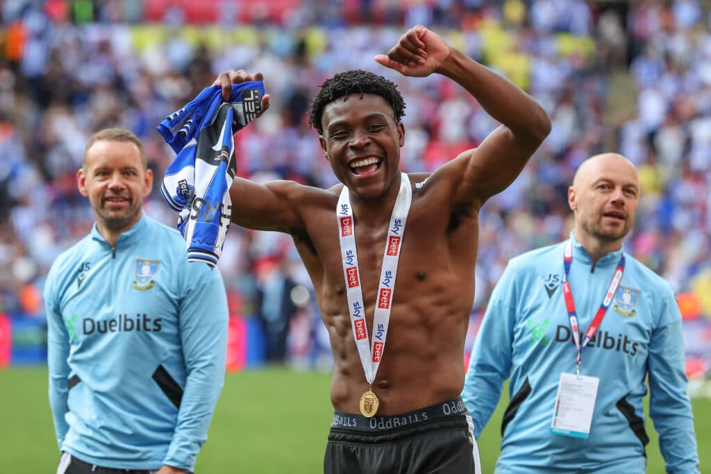 Fisayo Dele-Bashiru #17 of Sheffield Wednesday celebrates their win and promotion to the Championship