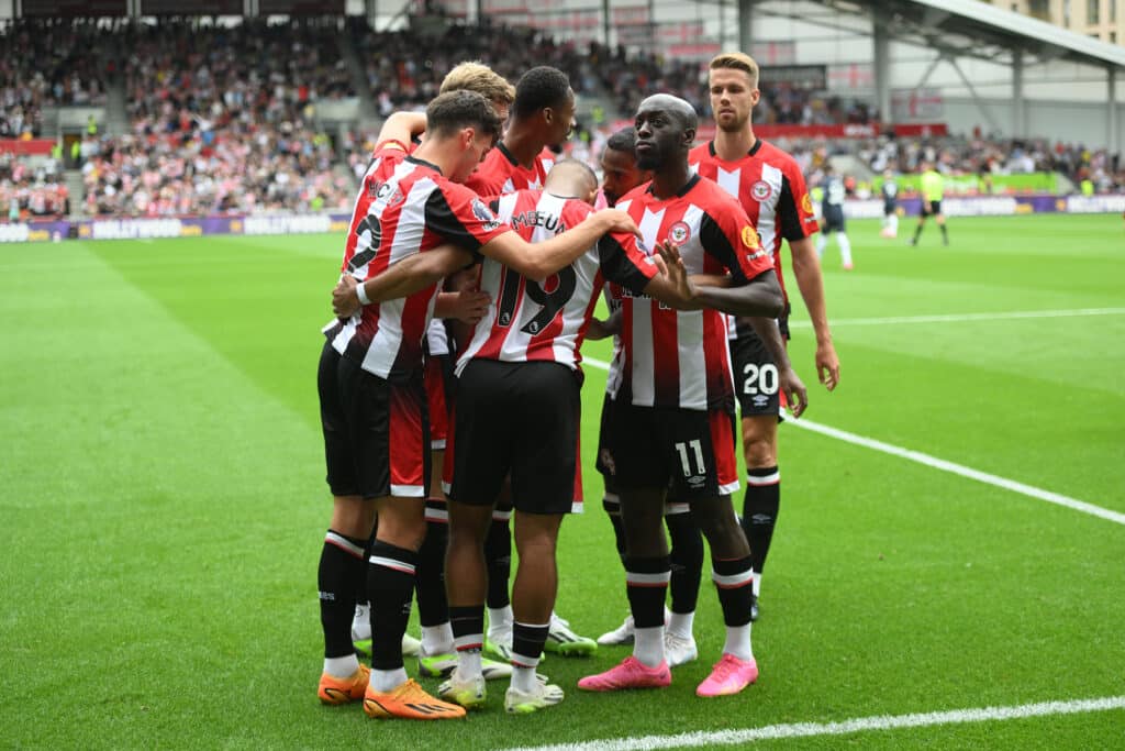 Brentford's Bryan Mbeumo celebrates scoring their first goal with team mates during the Premier League